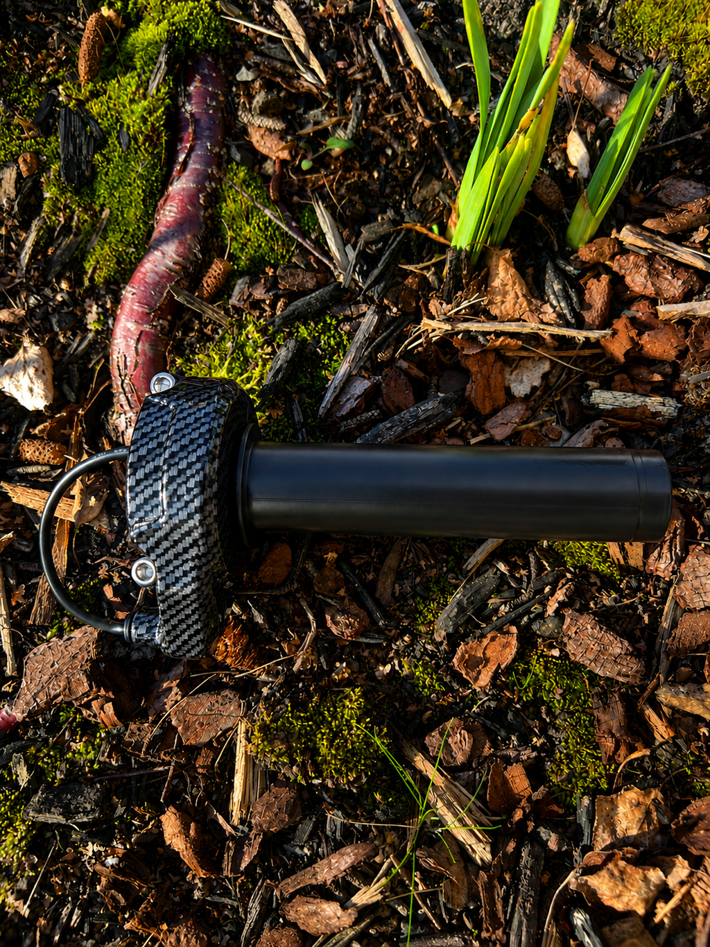 Velterra carbon fibre throttle installed on an e-bike on an outdoor adventure trail.