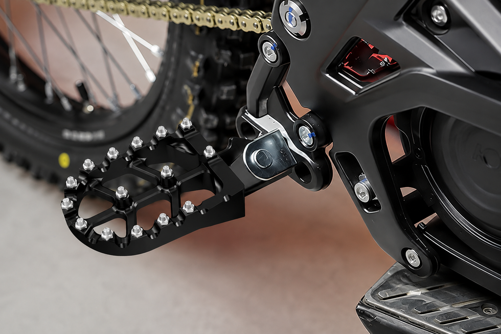Side profile showing the reinforced mounting bracket of Velterra dirt e-bike footpegs.
