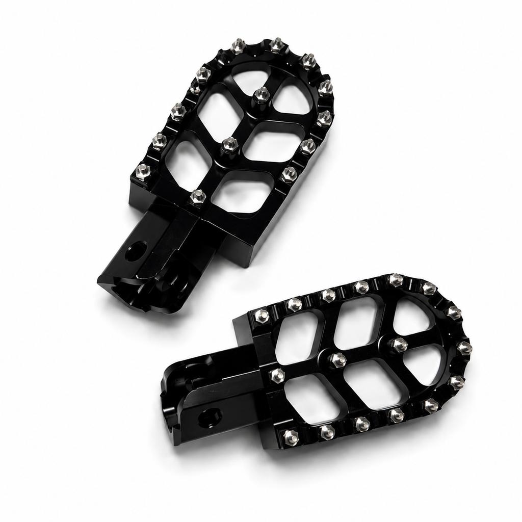 Detailed view of aggressive steel grip teeth on Velterra aftermarket footpegs.